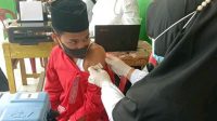 Siswa-Siswi di SMP Negeri 3 Gunung Talang Ikuti Vaksinasi Tahap Pertama